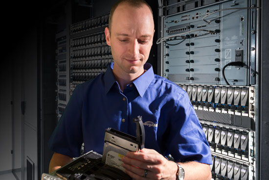 man in blue shirt in a server room